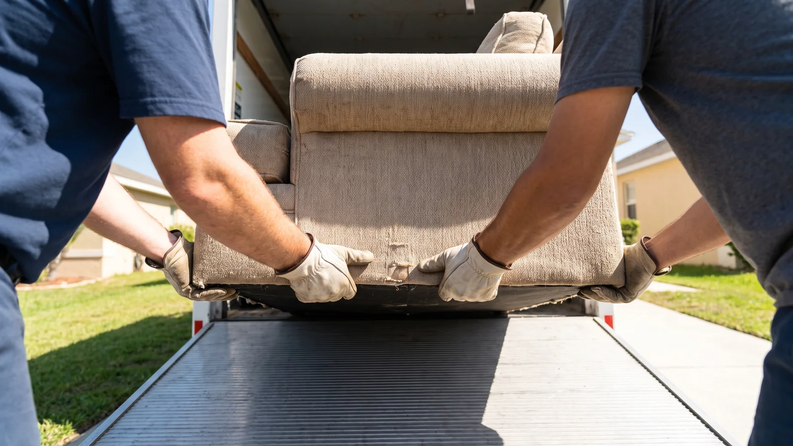 A junk removal crew loading a truck in Anaheim, CA